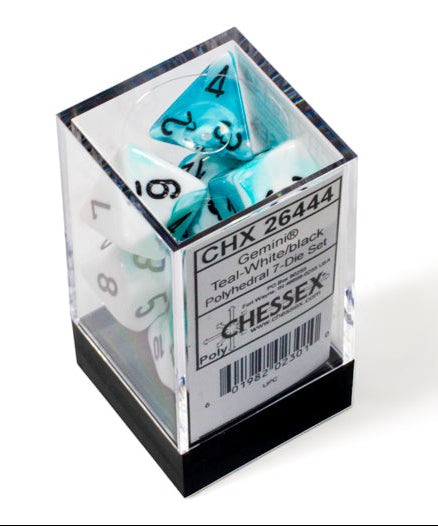 Set of Chessex dice in a clear cube with a white background